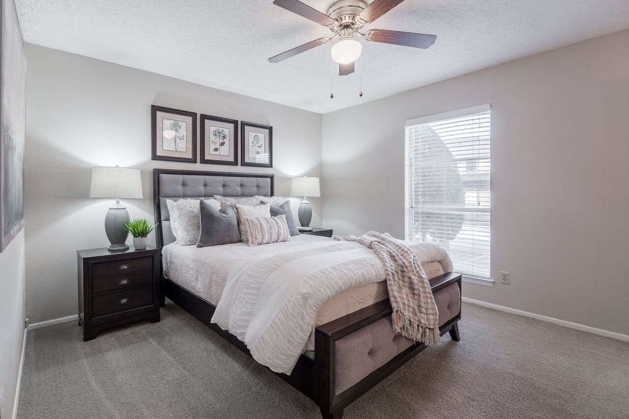 Spacious bedroom with ceiling fan  at Country Square, Carrollton, Texas
